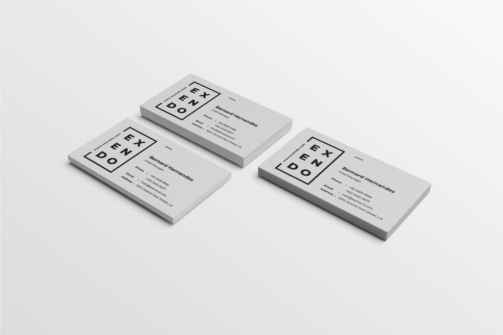 Three Exendo business cards on a light gray background