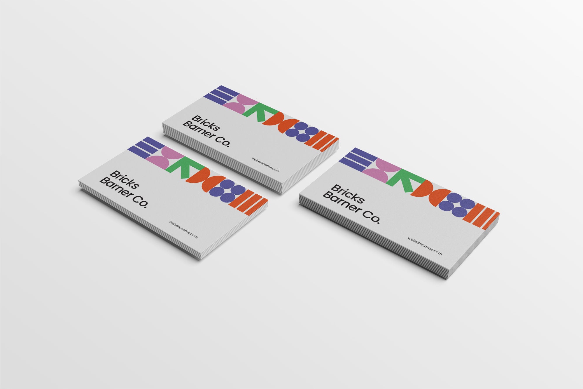 Three business cards with colorful text design on a white background