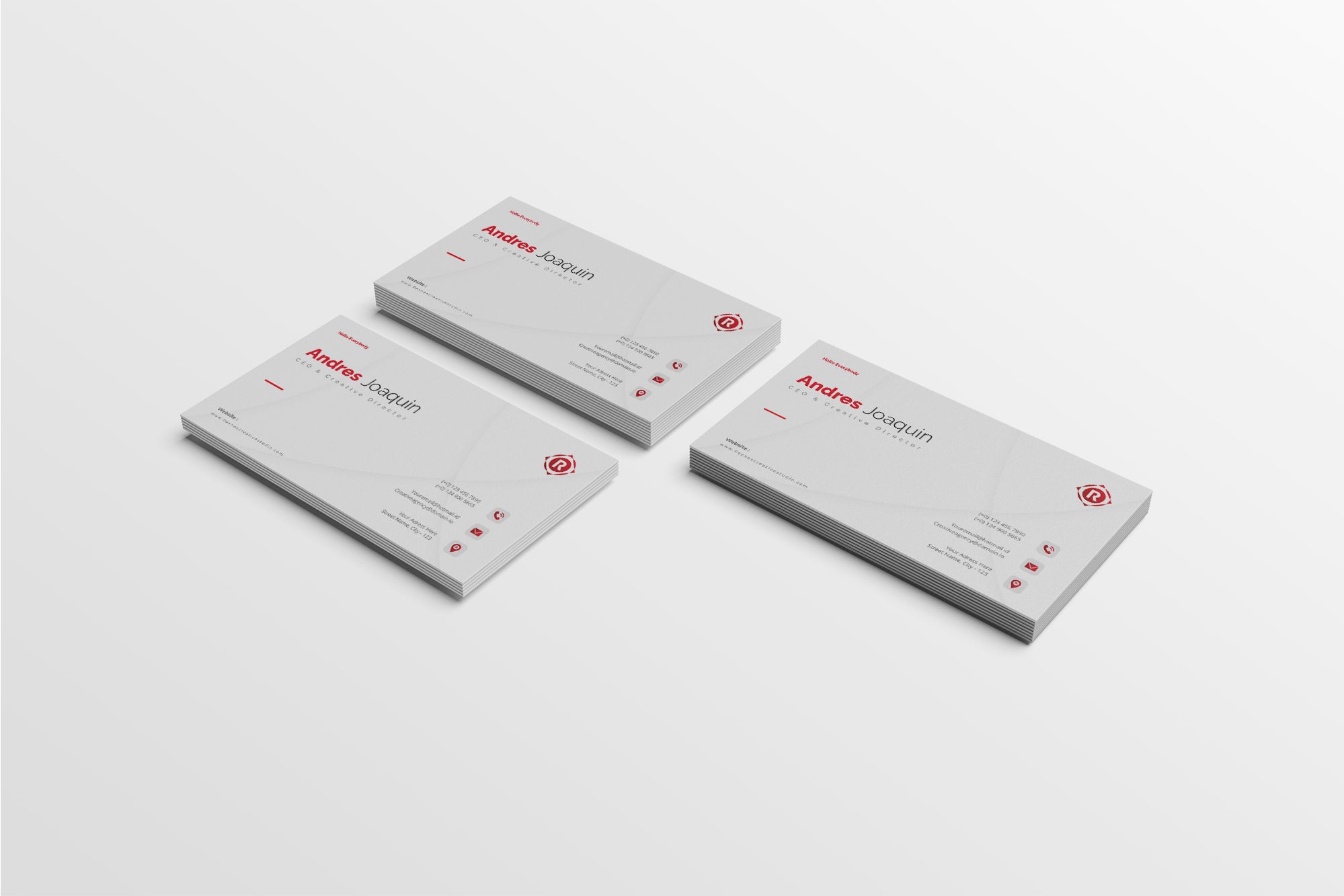 Three business cards with a red and black design on a white background