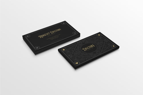 Two black leather-bound books with gold embossed text on a white background