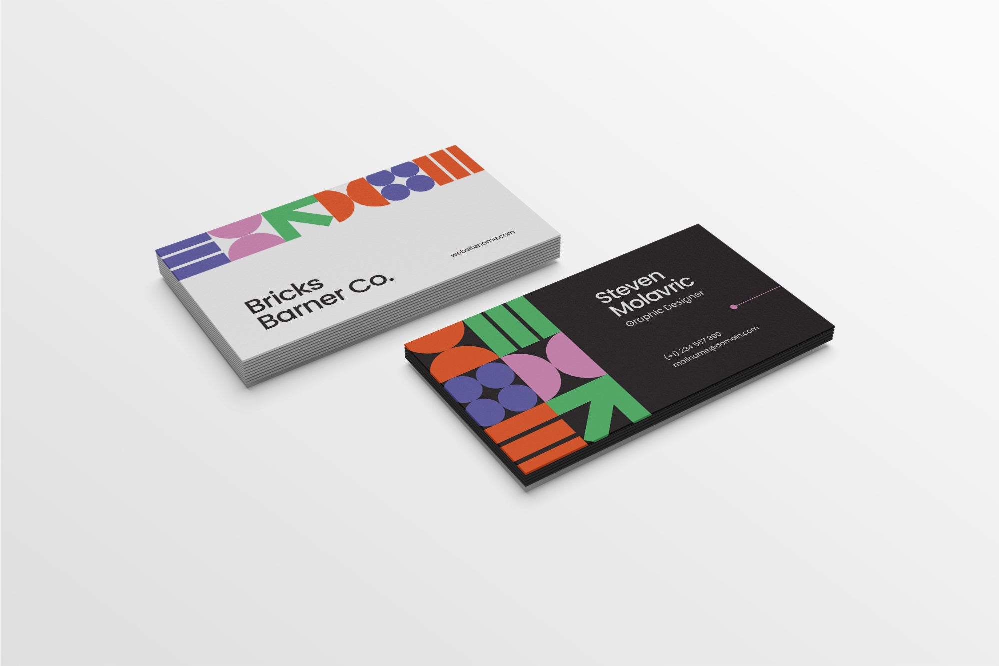 Colorful business cards with geometric designs on a white background